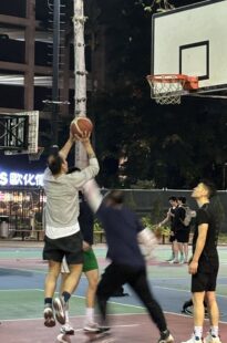 A man shoots the ball